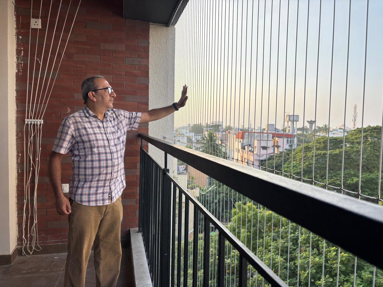 Invisible Grill Installation on Balcony with Panoramic City View